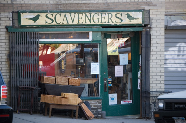 The storefront of a small antique or used goods
store.