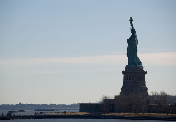 Silhouette of the Statue of Liberty.