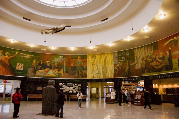 A mural on the history of flight rings a circular
room.