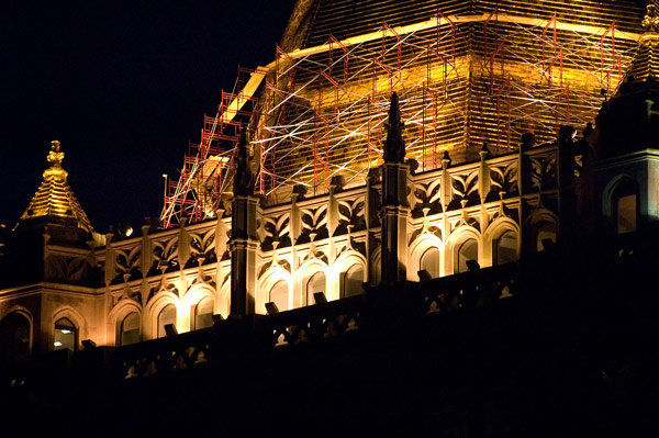 The gilded top of the New York Life building, lit at
night.