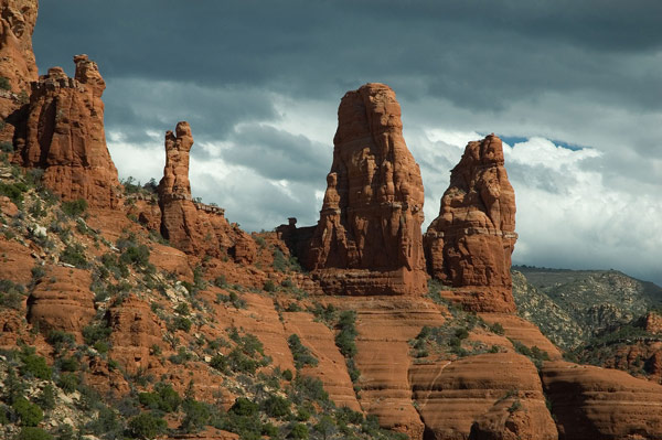 Red mesas stand out against a darkening sky.