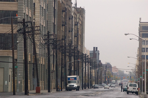 Warehouses fade into the distance, with old telephone
poles by their sides.