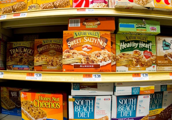 Colorful packages — greens, oranges, yellows, red
— on grocery store shelves.