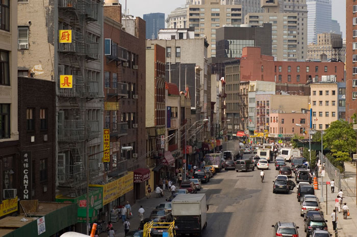 A long street view, with traffic in the distance.