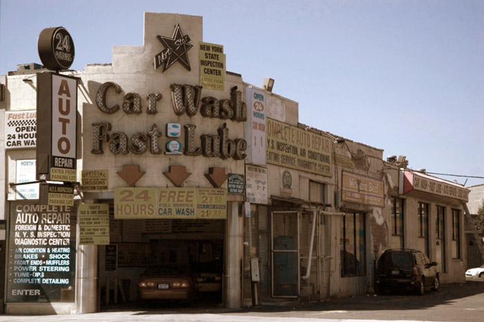 A car wash and auto service uses a variety of signs to attract
customers.