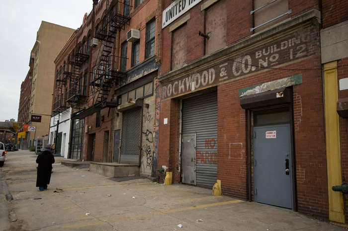 Looking down the street, past a brick building which formerly housed the Rockwood Chocolate Company.