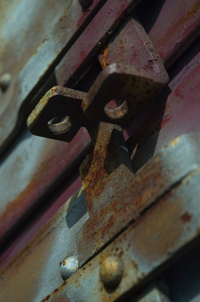 The hasp of a fire door is shown in close up.