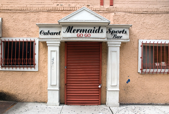 A night club called 'Mermaids' proclaims itself as a cabaret, a sports bar, and a go go. But it was closed during the day.