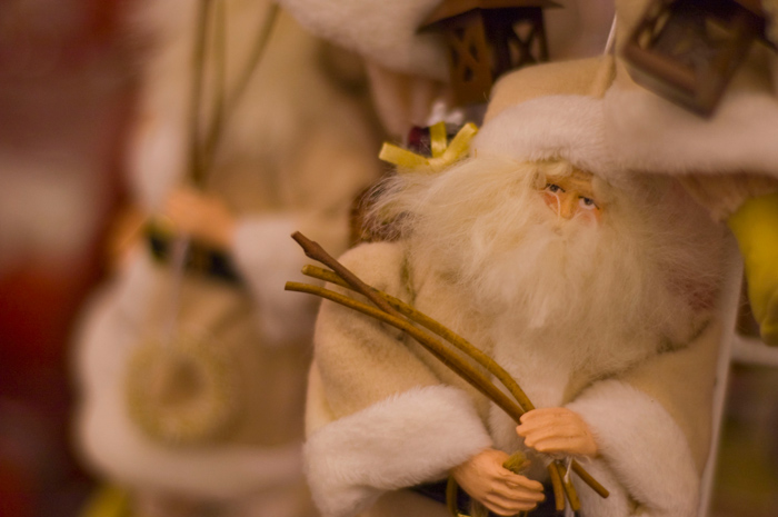 A St. Nicholas Christmas ornament, in soft browns and a long beard, seems to have a tired expression.
