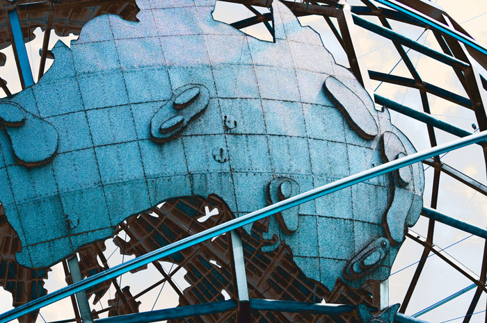 Australia's shape and topography are shown as a component in a huge metal globe.