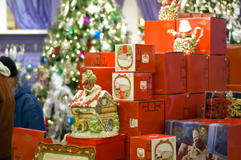 Red boxes with christmas decorations, at a store.