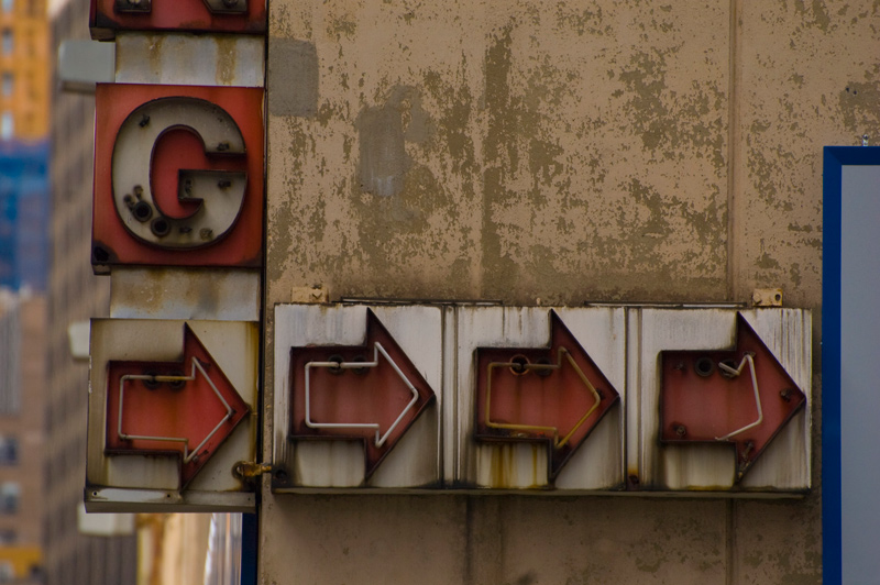 Details of a parking garage's neon sign, with detached neon tubes.