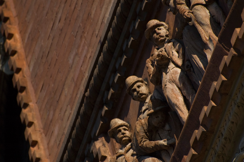 Terra Cotta figures of men in bowler hats.