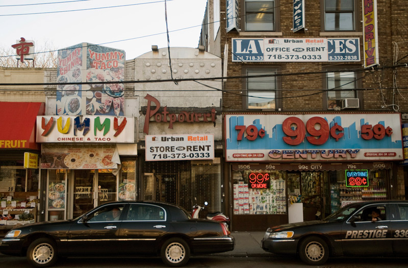 A row of storefronts, some vacant.