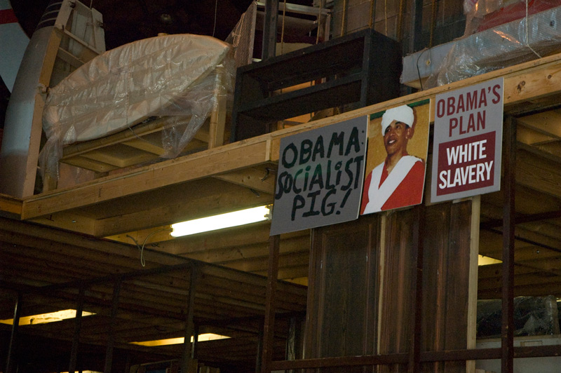 A poster in a room's rafters with anti-Obama rhetoric.