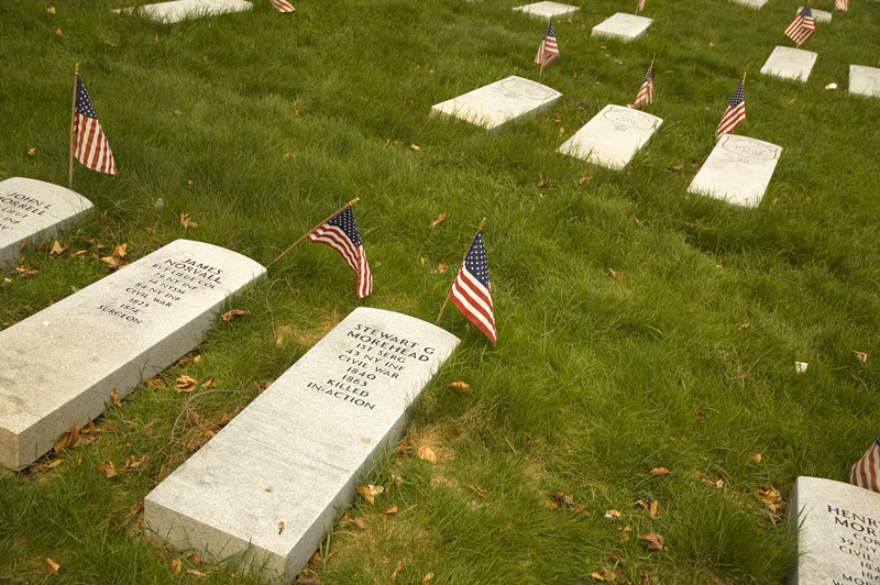 New tombstones for Civil War soldiers lie on the ground, waiting to be placed over graves.