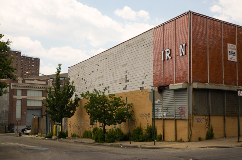 A vacant commercial building on empty street.