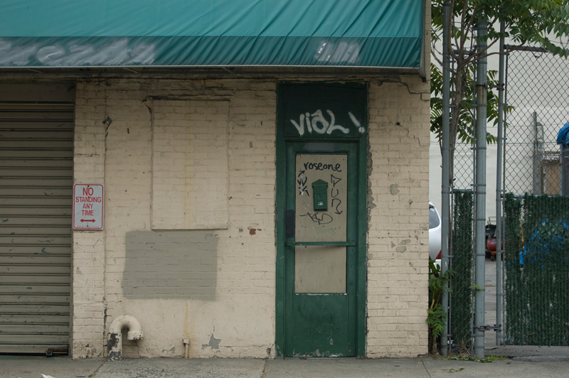 Graffiti tags on a door.