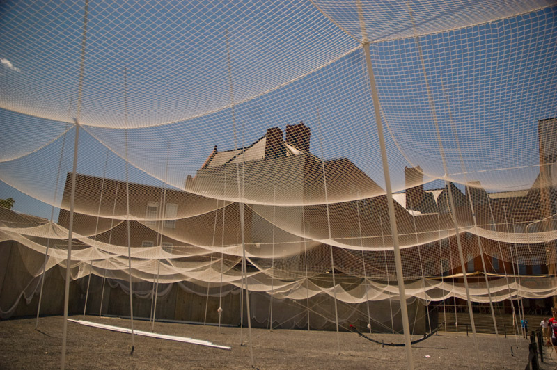 Netting on poles, suspended over a yard.