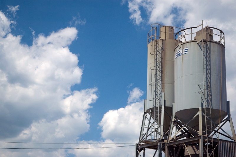 Silos against a blue sky.