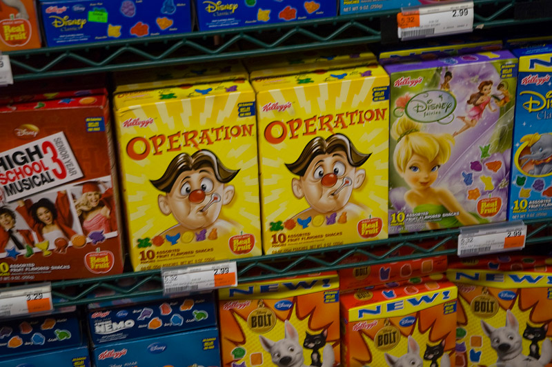 Grocery store shelves with packages geared to kids.