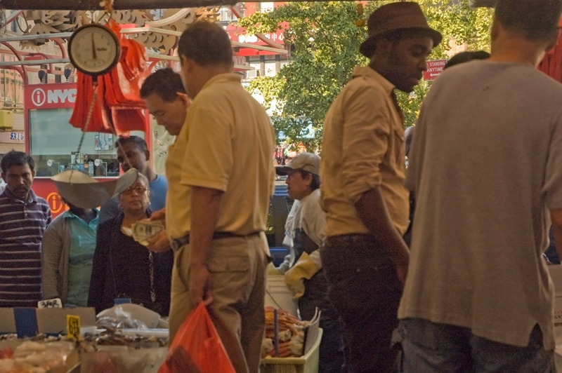 Buyers and workers in a store for fresh fish.