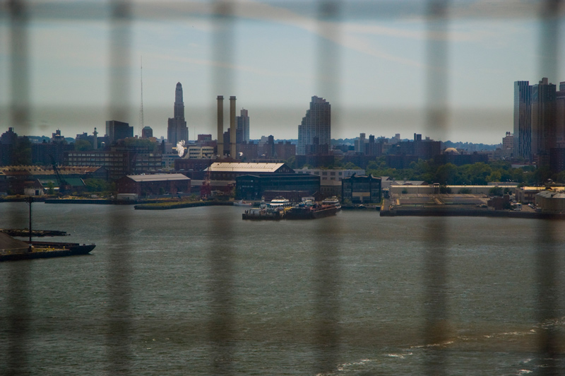 Industrial buildings, beyond a bay.