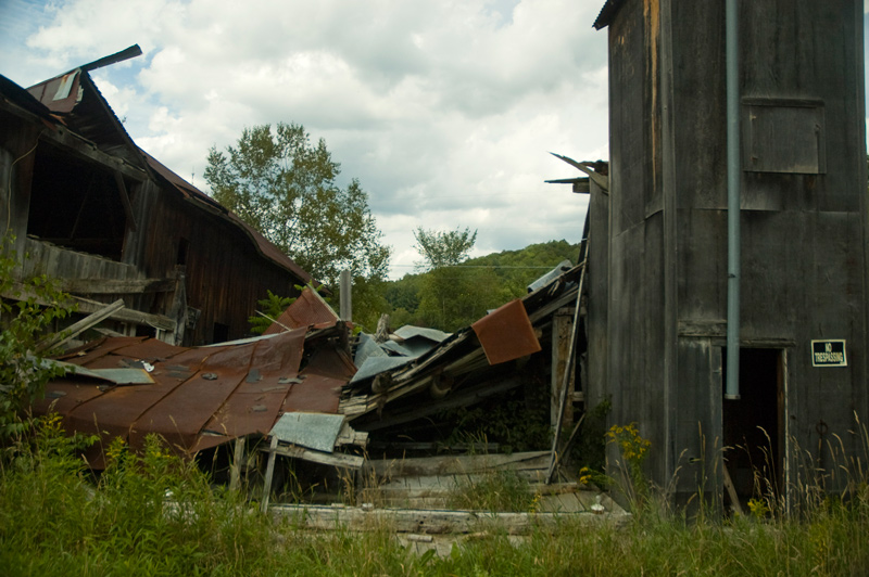 A collapsed wooden shack.