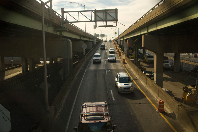 Cars coming down one section of a diverging expressway.