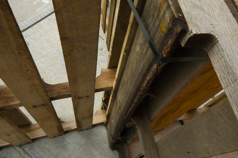 A wooden crate, standing on end.