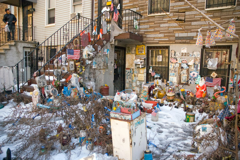 A hodgepodge of memorabilia in a snow-covered front yard.