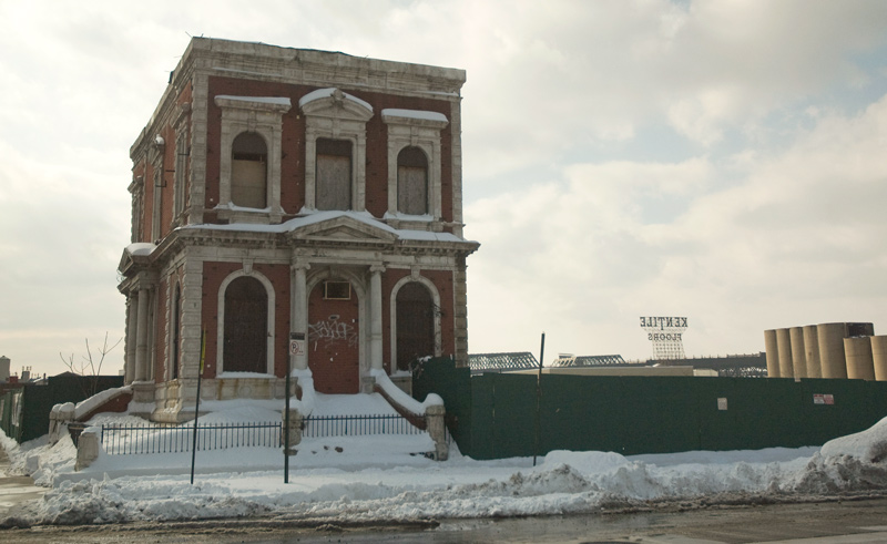 One two-story building remains on a block.