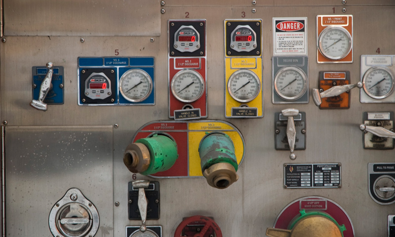 A dozen colorful gauges against a brushed chrome panel.