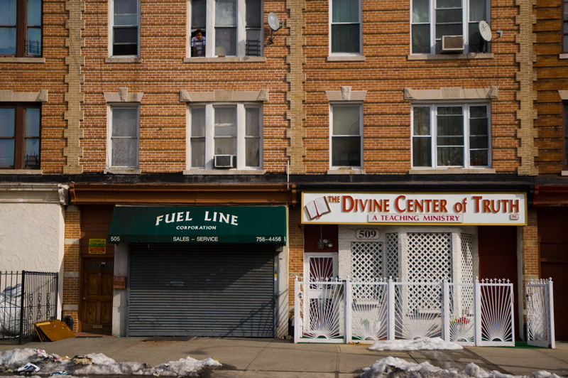 A storefront church, next to a fuel company.