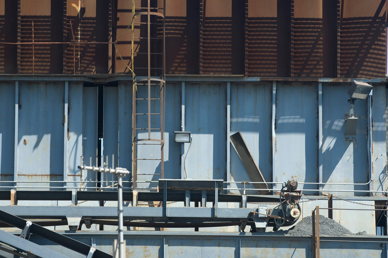 Steel walls, ladders, and conveyor belts.