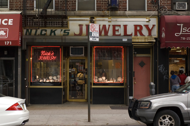 A jewelry store, with neon in the windows.