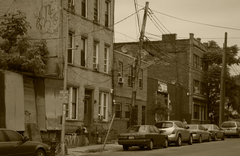 Short row houses on a run-down block.