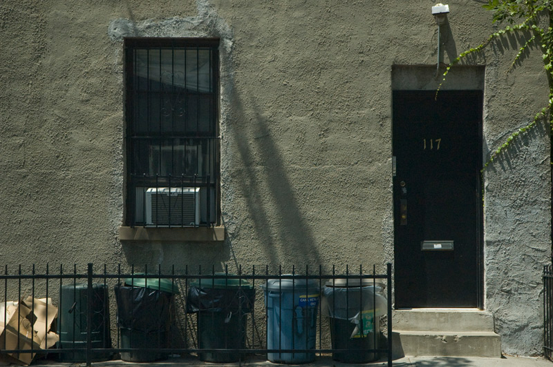 Sunlight and shadows on the flat front of a home.