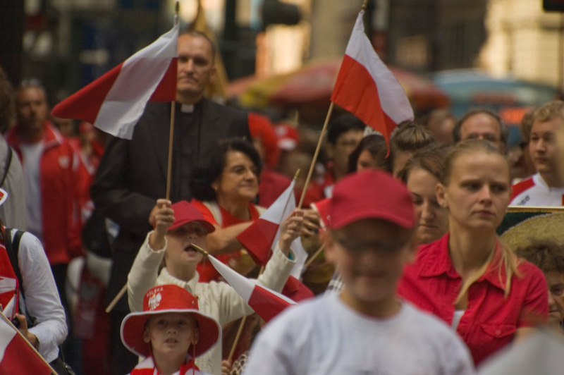 A crowd of people, dressed in red and white
