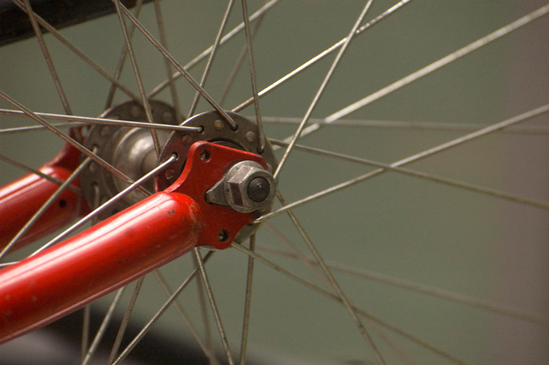 The ends of a bicycle fork, on the hub of a wheel.