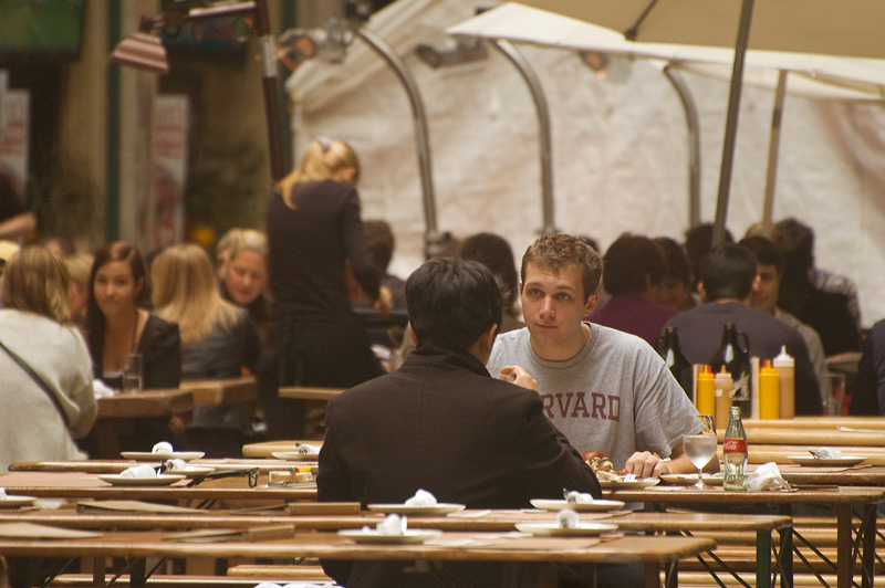 A man listens intently to his lunch partner.