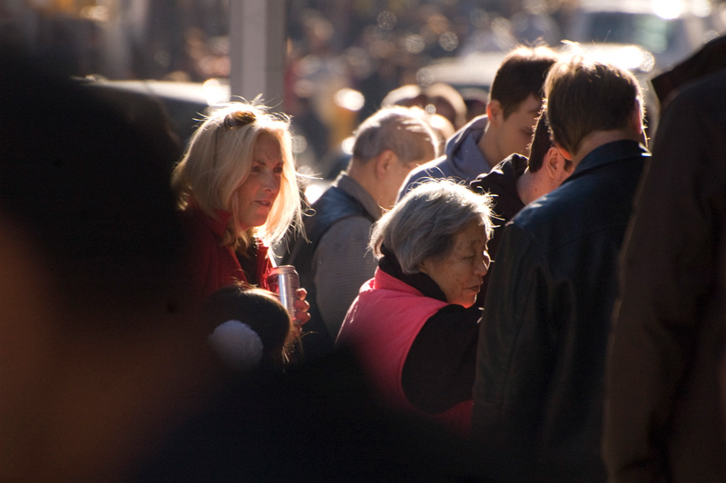 A woman on a crowded street.