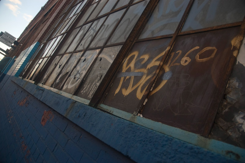 Old window panes, covered in graffiti.