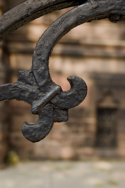 Curves of an iron fence.