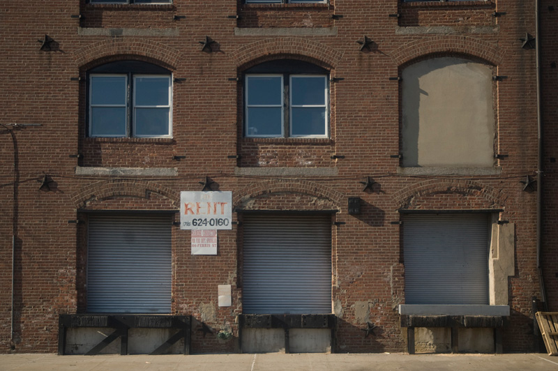 An old brick warehouse, with loading docks.