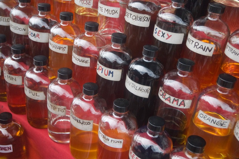 Bottles of scented liquids, one labeled 'Obama'.