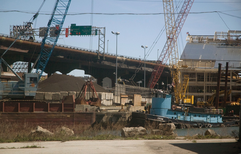 A tugboat named 'Crow' in an industrial setting