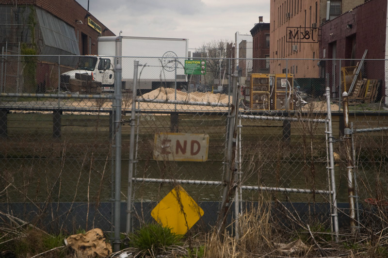 Chain link fence at the end of a road