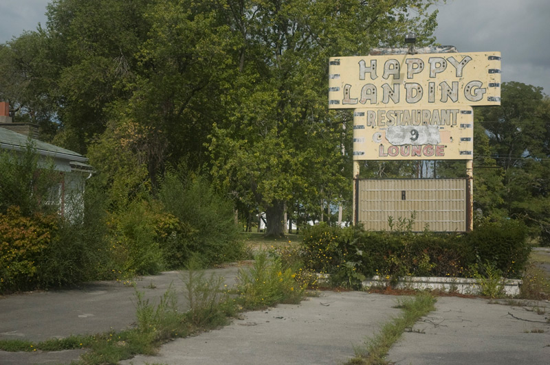 An old neon sign for a closed restaurant.