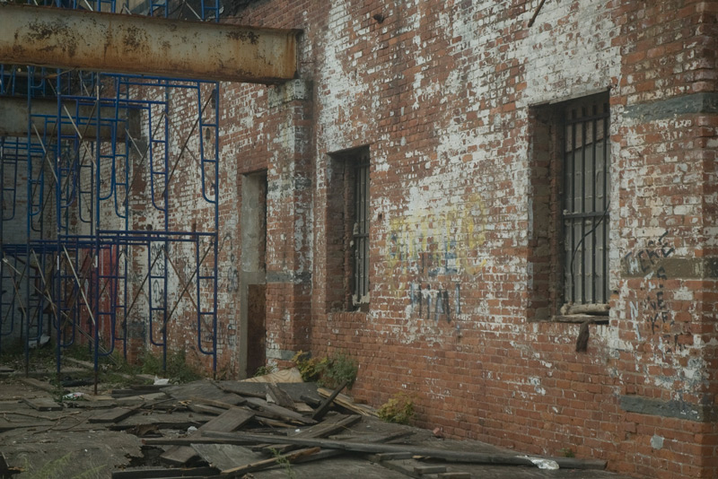 Scaffolding and a brick wall.